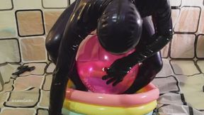 Latex Man Pissing and Fucking balloons