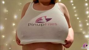 Sara Wiilis wearing a tank top focusing her enormous boobs