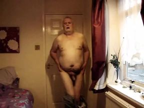 Mature man strips and jerks off.