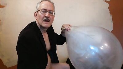 Horny grandpa Jack is rubbing his hard pecker on a huge balloon