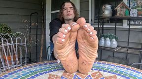 Boy shows off his dirty soles