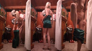 Blonde in green satin dress undresses herself slowly