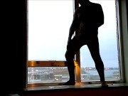 bad lighting but leopard jerking off in hotel window