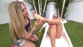 my sissy slut licked and massaged my feet in the pool