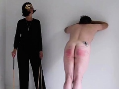 Pitiful slave spanked hard by merciless MILF mistress