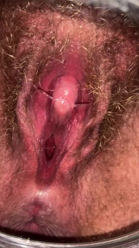 Hairy trans guy shows off his smooth pussy in a group setting