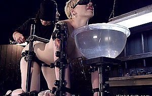 Strapped blonde pussy toyed in device