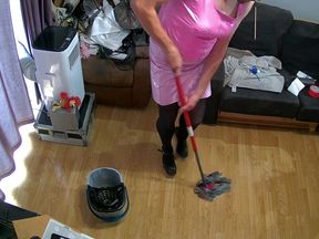 Mainboots cleaning the lounge in pink pvc outfit and high heel