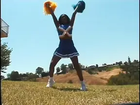 Voluptuous black cheerleader rides and sucks big black cock