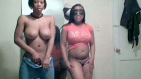 Two black nymphos flash their big bubble asses while stripping