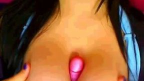 Amazing cam girl was jamming bright pink dildo between her boobies