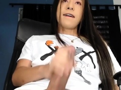 Young Tranny Shows Off Her Big Cock in an Explosive StripTan