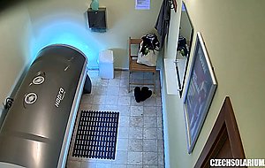 Shaved and tight pussy caught in solarium