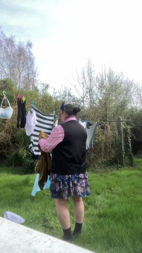 In outfit shirt tie and skirt to hang laundry outside part2