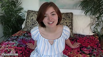 Adorable girl with short hair, Aria Sky spreads her legs wide open to show us her pussy