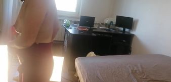 Amateur woman has fun trying on clothes and cutting them. Amateur woman vacuuming naked in the house.