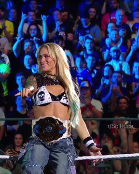 Blonde wrestler shows off abs and muscles in celebrity thong