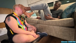 Black dudes feet are licked and worshipped by chubby bear