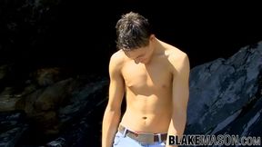 Sexy jock Warren wanking his big cock on the seaside rocks