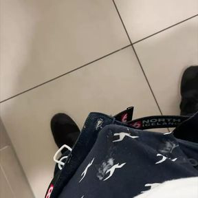 boy is wanking in mall stall bathroom