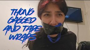 Thong gagged and tape wraps, fighting and moaning till remove