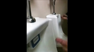 two slim dicks getting wanked at the urinals 4