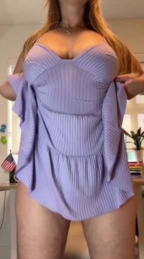 Blonde woman in purple dress