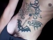 Horny inked twink smokes and flashes hard cock