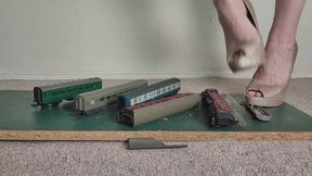 Giantess Lily Kink toy car crush of train coaches in big heels Close ground view