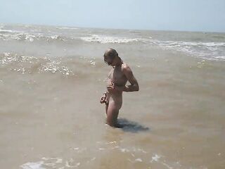 Swimming, splashing and posing nude in the sea...