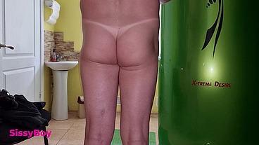 TANNED ASS AFTER A SOLARIUM. CROSSDRESSER IN A CHASTITY BELT IN A THONG FROM A TANNING BED.