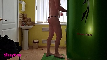 TANNED ASS AFTER A SOLARIUM. CROSSDRESSER IN A CHASTITY BELT IN A THONG FROM A TANNING BED.