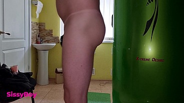 TANNED ASS AFTER A SOLARIUM. CROSSDRESSER IN A CHASTITY BELT IN A THONG FROM A TANNING BED.
