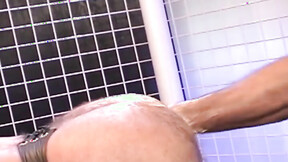 Hunky homosexual in his jockstrap endures having his butt fist banged by his budd