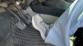 Anie plays barefoot with the pedals of the Chevette.