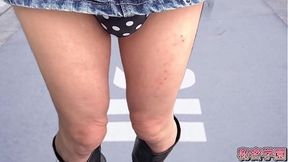 Solo amateur girl in miniskirt boots and polka dot panties masturbates in bathroom
