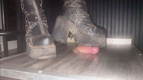 Stomping a cock beneath my chunky goth boots