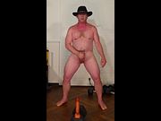Cowboy masturbates and cums over a big dildo