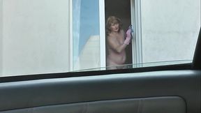 Neighbor's beautiful MILF wife shows off big tits and hairy pussy while washing windows