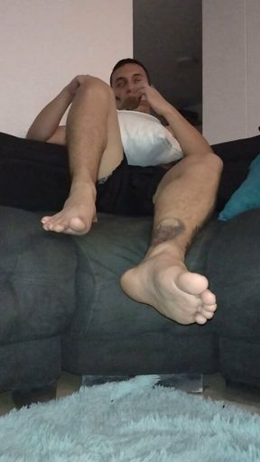 Latino shows his feet while eating