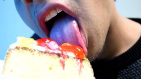 eating cake with his mouth
