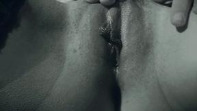 ”A finger in her tight butt while she rubs her bushy cunt eagerly”