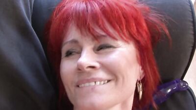 MAture woman is being fucked on the couch by a black stud