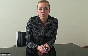 Cute blonde gives an interview in the room