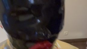 Rubbermissy selfenjoyment of a black Rubberdoll with blindfold and gag in full latex catsuit
