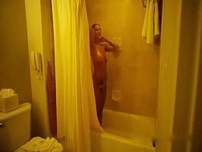 Sensual chick with a great body having a seductive shower