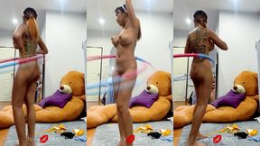 naked fitness queen spins hula hoop and flashes her juicy ass cheeks