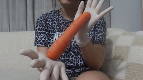 My Stepsister in medical white gloves plays with a yellow carrot