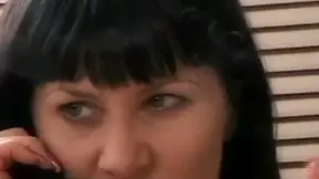 Brunette whore masturbating while having sex over the phone