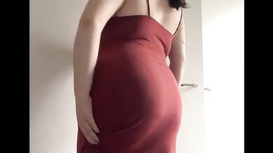 Secretary’s stuffed belly bulges tight in her red dress